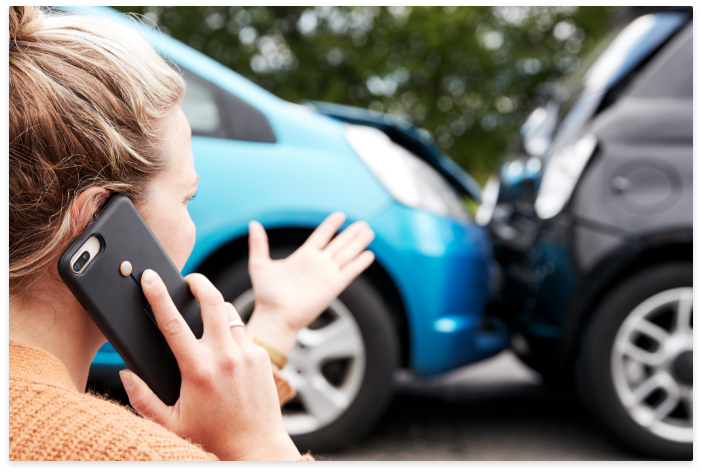 woman on a cell phone reporting an accident
